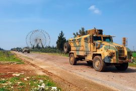 A Turkish armoured vehicle leading a joint patrol with Russia along Syria's M4 highway.