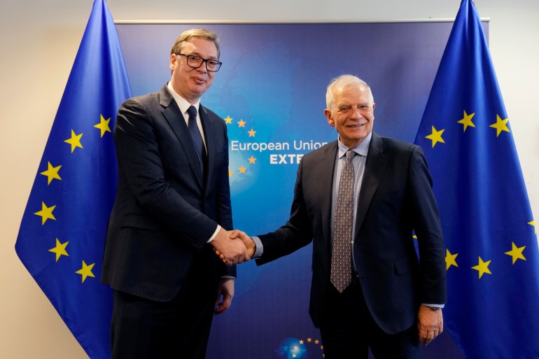 Serbian President Aleksandar Vucic shakes hands with European Union foreign policy chief Josep Borrell