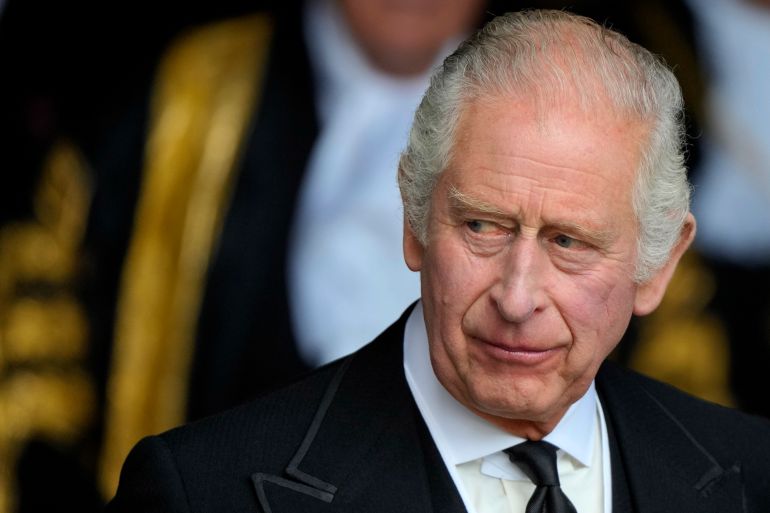 King Charles III leaves Westminster Hall, in the Palace of Westminster, where the House of Commons and the House of Lords met to express their condolences in London, Monday, Sept. 12, 2022.