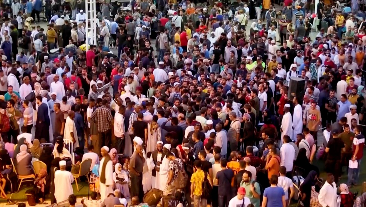 In this screen grab taken from video, Sudanese and foreigners arrive in Port Sudan