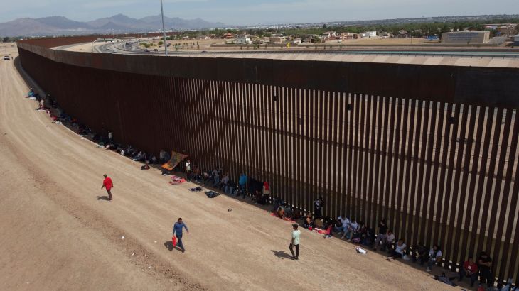 Asylum seekers camp out next to the border wall between the US and Mexico