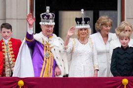 Britain's King Charles III and Queen Camilla wave to the crowds