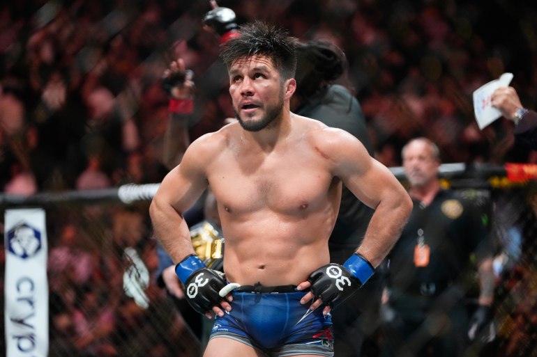 Henry Cejudo reacts after losing to Aljamain Sterling