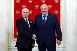 Russian President Vladimir Putin, left, and Belarusian President Alexander Lukashenko shake hands at their meeting during the 78th anniversary of the end of World War II celebrations in Moscow, Russia, Tuesday, May 9, 2023. (Vladimir Smirnov, Sputnik, Kremlin Pool Photo via AP)