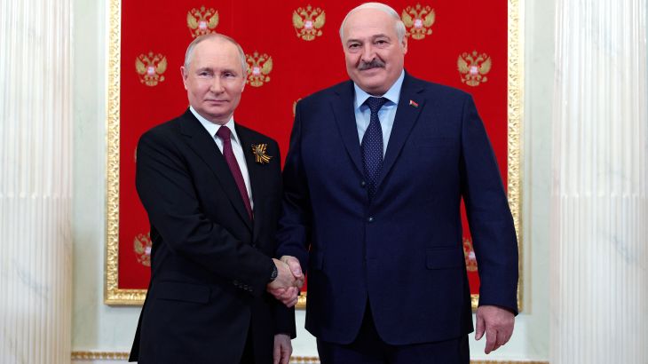 Russian President Vladimir Putin, left, and Belarusian President Alexander Lukashenko shake hands at their meeting during the 78th anniversary of the end of World War II celebrations in Moscow, Russia, Tuesday, May 9, 2023. (Vladimir Smirnov, Sputnik, Kremlin Pool Photo via AP)