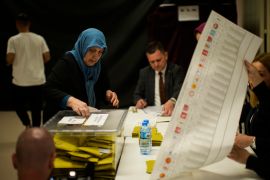 A woman votes at a polling station in Istanbul, Turkey, Sunday, May 14, 2023.