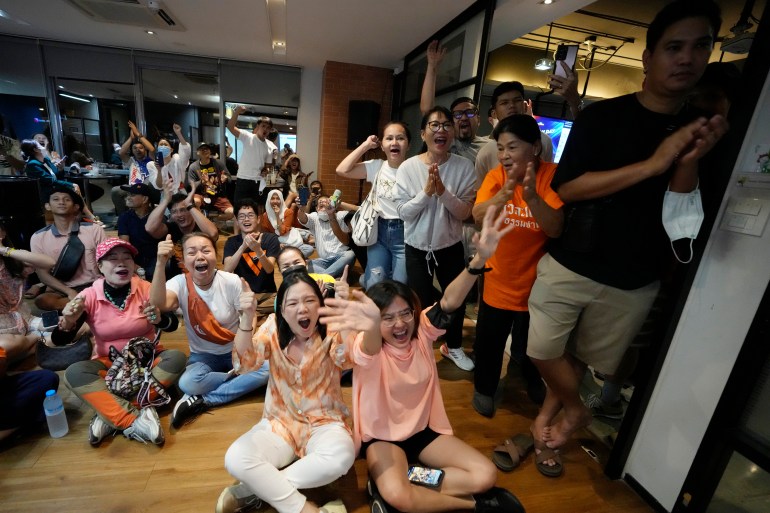 MFP supporters cheer as they watch counting of votes in Bangkok, Thailand.