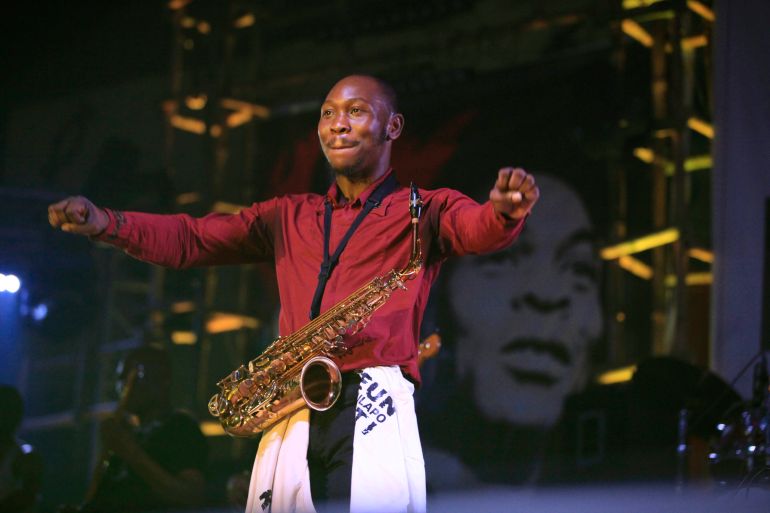 FILE- Seun Kuti, son of Afrobeat music legend Fela Kuti, performs at "Felabration," an annual event paying homage to his father,at the New Afrika Shrine in Lagos, Nigeria in the early hours of Oct. 20, 2013. A Nigerian Afrobeat star was arrested after being accused of assaulting a police officer in the commercial hub of Lagos. Seun Kuti was detained at the Lagos State police headquarters after turning himself in on Monday, May 15, 2023. (AP Photo/Sunday Alamba, File)