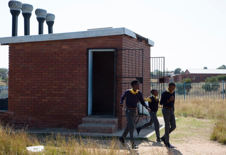 Students leave a toilet during recess at Seipone Secondary School in the rural village of Ga-Mashashane, near Polokwane, South Africa, Thursday May 4, 2023. [Denis Farrell/AP Photo]