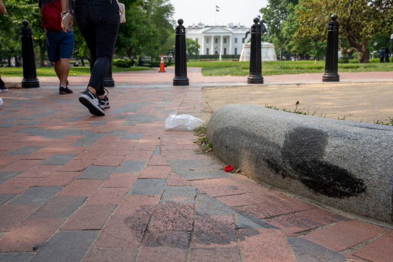 Tire marks remain on a curb in Lafayette Square park near the White House