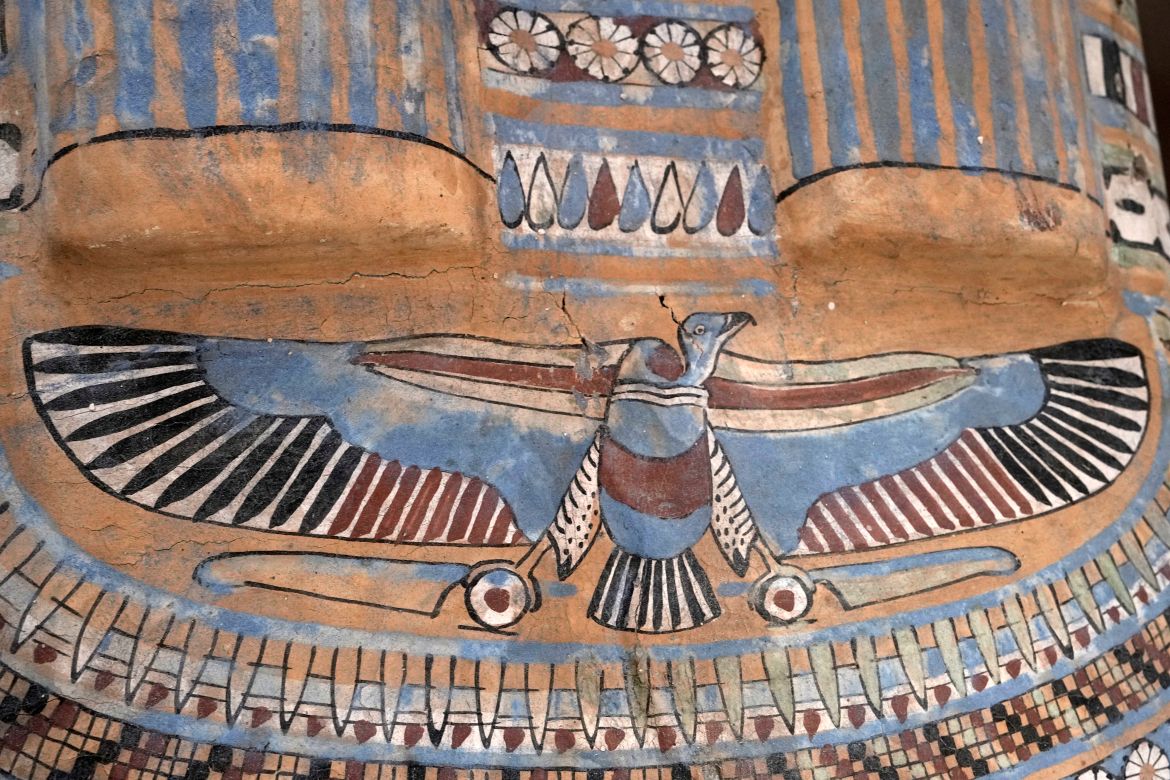 A colored painting is seen on a recently unearthed ancient wooden sarcophagus