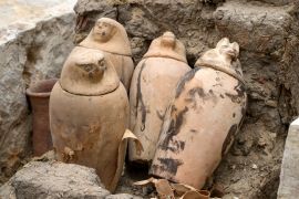 Canopic jars, which were made to keep the organs removed during the process of mummification, are seen at the site of the Step Pyramid of Djoser in Saqqara, 24km (15 miles) southwest of Cairo. [Amr Nabil/AP Photo]