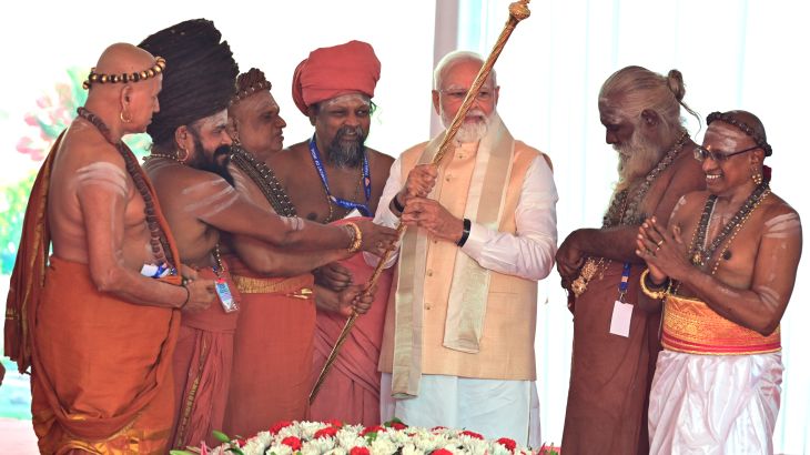 Hindu priests hand over a royal golden sceptre to Indian prime minister Narendra Modi to be installed near the chair of the speaker during the start of the inaugural ceremony of the new parliament building, in New Delhi, India, Sunday, 28 May 2023. The new triangular parliament building, built at an estimated cost of $120 million, is part of a $2.8 billion revamp of British-era offices and residences in central New Delhi called "Central Vista", even as India's major opposition parties boycotted the inauguration, in a rare show of unity against the Hindu nationalist ruling party that has completed nine years in power and is seeking a third term in crucial general elections next year