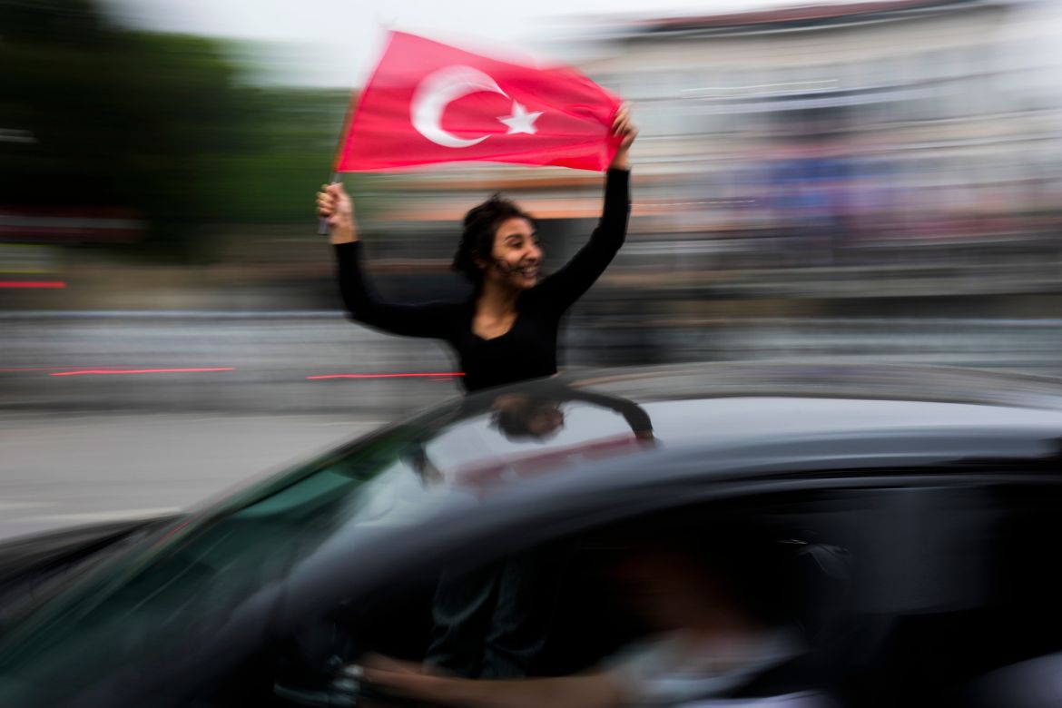 A supporter of the President Recep Tayyip Erdogan holds a Turkish flag