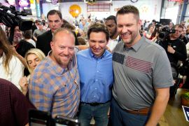 Florida Governor Ron DeSantis (centre) attends a fundraising picnic for Republican Representative Randy Feenstra in Sioux City, Iowa, on May 13, less than two weeks before announcing his presidential campaign [File: Charlie Neibergall/AP Photo]