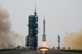 The Long March 2F rocket carrying three Chinese astronauts in a Shenzhou-16 spaceship as it lifts off [Mark Schiefelbein/AP Photo]