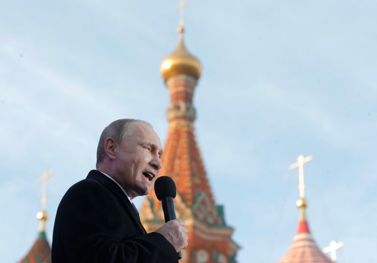 Russian President Vladimir Putin speaks at a rally marking the one-year anniversary of the annexation of Ukraine's Crimea peninsula, outside the Kremlin, Moscow, Russia, Wednesday, March 18, 2015.
