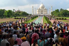 Tourists crowd the Taj Mahal in Agra, India, Saturday, Aug. 10, 2013. The Taj Mahal is a marble mausoleum built by Mughal emperor Shah Jahan in memory of his third wife Mumtaz Mahal. (AP Photo/Pawan Sharma)