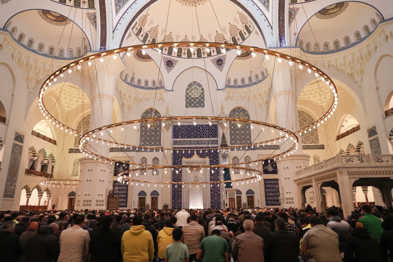Muslims gather at the Grand Camlica Mosque