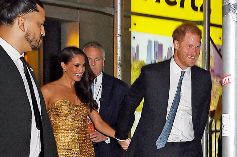 Meghan Markle, Duchess of Sussex and Prince Harry, Duke of Sussex leave event with security guards