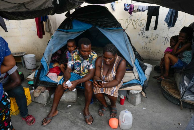 Migrants huddle in a tent in the Mexican border city of Reynosa