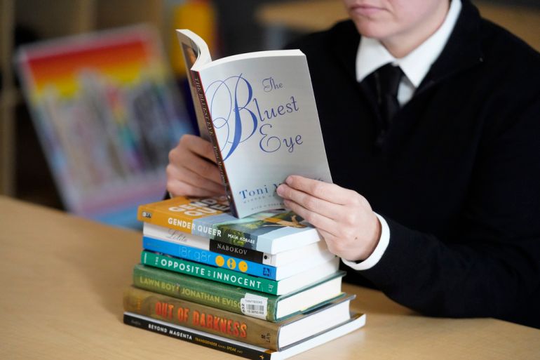 A student reads a library book