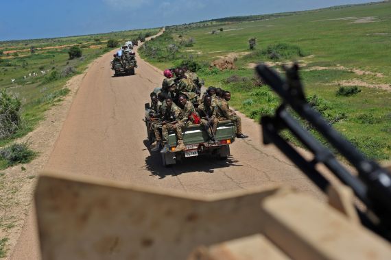 Somali soldiers patrol in convoy near Sanguuni military base