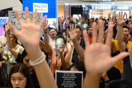 Pro-democracy protesters gather to for a singing rally of Glory to Hong Kong at shopping mall in September 2019 [File: Philip Fong/AFP]