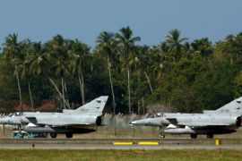 Sri Lankan Air Force's Kfir fighters prepare to take off at Bandaranaike International Airport, near Colombo January 2, 2009. Sri Lankan troops fought their way into the Tamil Tigers' de facto capital of Kilinochchi and the entire town will soon be under government control, an official said on Friday, in what would be a major blow for the rebels. REUTERS/Buddhika Weerasinghe (SRI LANKA)
