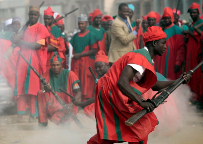 Traditional palace guards of Emir of Kano, Ado Bayero, fire locally made muskets to mark the end of prayers on the first day of the Muslim holiday of Eid al-Adha in Kano