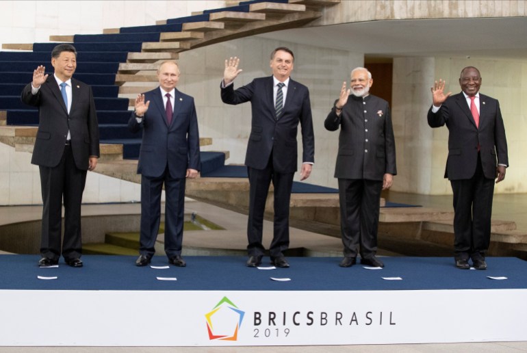 From left to right, China's President Xi Jinping, Russia's President Vladimir Putin, Brazil's President Jair Bolsonaro, India's Prime Minister Narendra Modi and South Africa's President Cyril Ramaphosa pose for a photo at the BRICS emerging economies meeting at the Itamaraty palace in Brasilia, Brazil, November 14, 2019. Pavel Golovkin/Pool via REUTERS