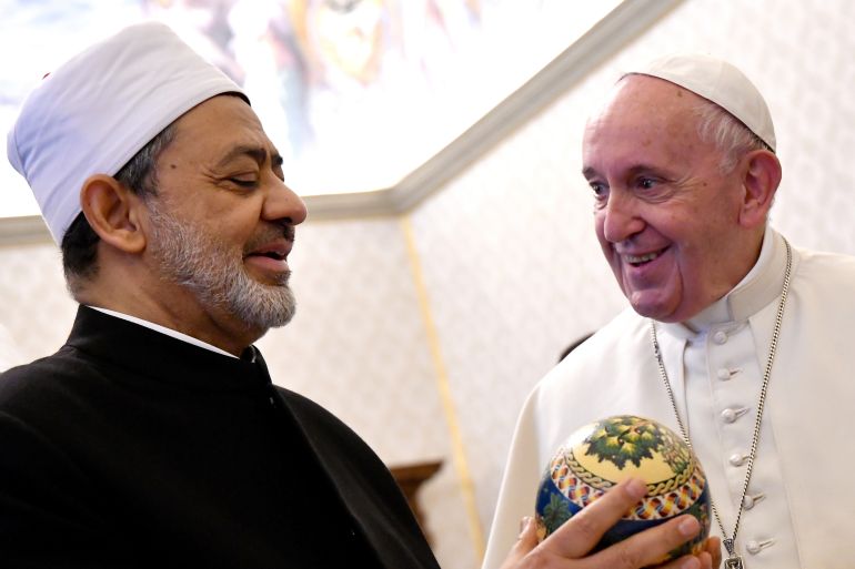 Pope Francis receives a gift from Grand Imam Ahmed Al-Tayeb Sheikh of Al-Azhar during a private audience at the Vatican November 15, 2019. Alberto Pizzoli/Pool via REUTERS