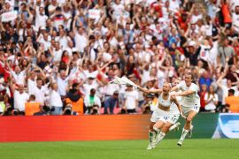 Soccer Football - Women's Euro 2022 - Final - England v Germany - Wembley Stadium, London, Britain - July 31, 2022 England's Chloe Kelly celebrates scoring their second goal with Jill Scott and Lauren Hemp