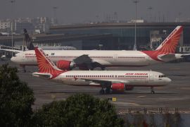 Air India passenger aircraft are seen on the tarmac at Chhatrapati Shivaji International airport in Mumbai [File: Francis Mascarenhas/Reuters]