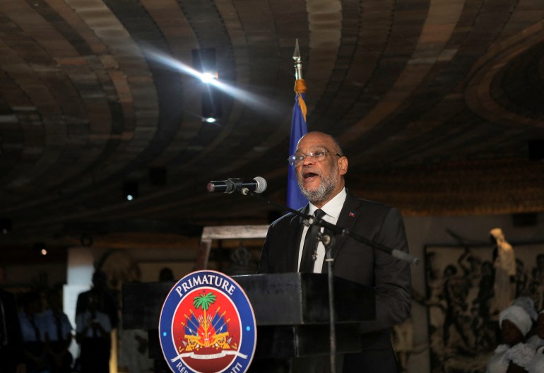 Haiti's Prime Minister Ariel Henry addresses the audience at events commemorating the 220th anniversary of the death of revolutionary leader Toussaint Louverture in Port-au-Prince