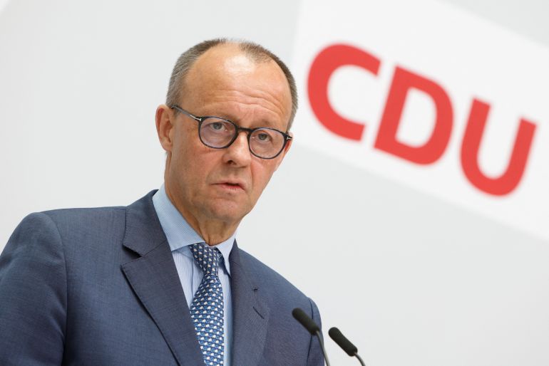CDU leader Friedrich Merz addresses the media