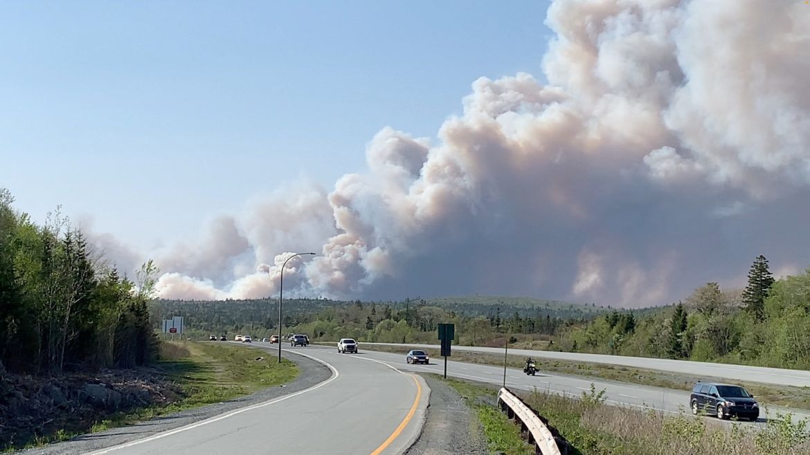 Large plumes of smoke rise from a wildfire raging in the Upper Tantallon area,