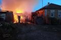 Firefighters work at a house on fire following a shelling, which, according to the regional governor, was by Ukrainian forces, in the village of Sobolevka, Belgorod region, Russia.