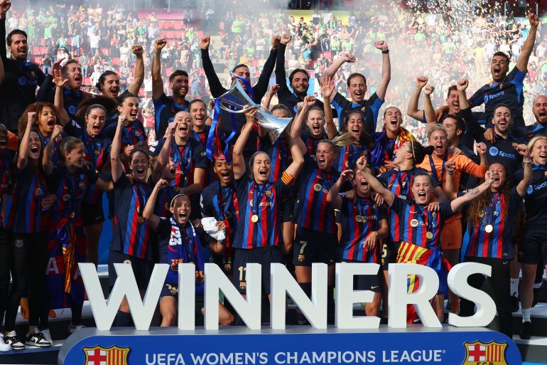 FC Barcelona's Alexia Putellas lifts the trophy with teammates after winning the Women's Champions League final. [REUTERS/Yves Herman]