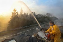 A firefighter works to put out a fire in Canada's province of Nova Scotia