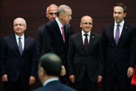 Turkish President Recep Tayyip Erdogan next to his new treasury and finance minister, Mehmet Simsek, second from right, during a press conference in Ankara, Turkey, June 3, 2023 [Umit Bektas/Reuters]