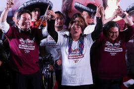 Delfina Gomez, centre, candidate for governor of the state of Mexico for the National Regeneration Movement (MORENA), celebrates after preliminary results in the state election were announced in Toluca [Henry Romero/Reuters]