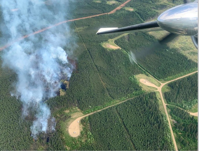 Smoke rises from a wildfire in Alberta, Canada
