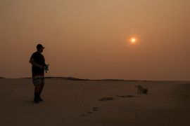 Wildfires in Canada have caused smoke-filled, discoloured skies in Canadian and US cities [Shannon Stapleton/Reuters]