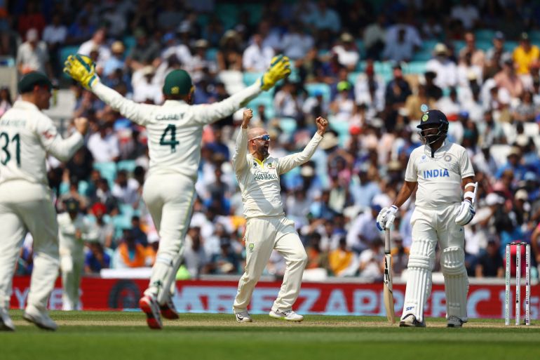 Australia's Nathan Lyon celebrates after taking the wicket of India's Mohammed Siraj to win the World Test Championship final