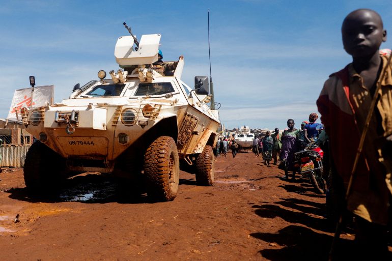 A United Nations Organization Stabilization Mission in the Democratic Republic of the Congo (MONUSCO) armoured personnel carrier (APC) drives through a road in Rhoe camp for the internally displaced people (IDPs) in Djugu's territory, Ituri's province