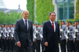 German Chancellor Olaf Scholz and Chinese Premier Li Qiang review the troops during German-Chinese government consultations in Berlin, Germany