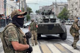 Fighters of Wagner private mercenary group stand guard in a street near the headquarters of the Southern Military District in the city of Rostov-on-Don, Russia, June 24, 2023