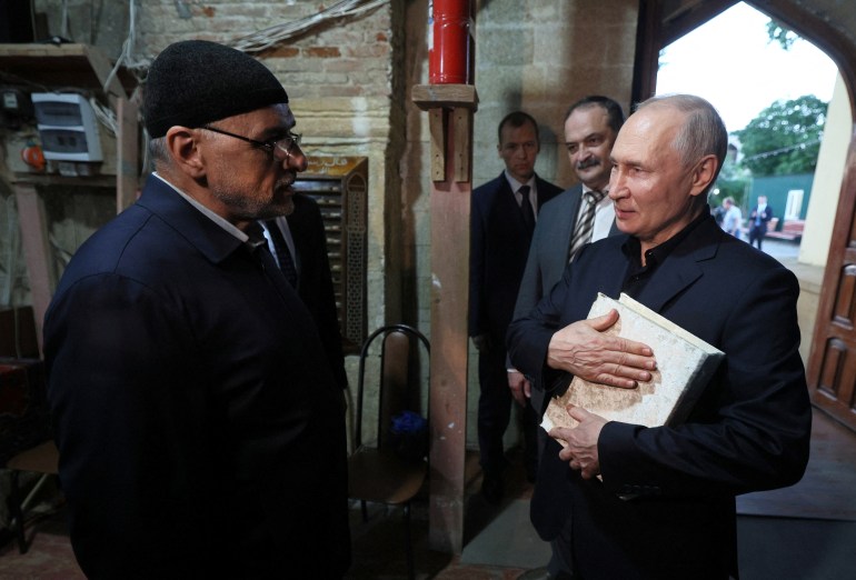 Russian President Vladimir Putin received the Quran holy book as a gift during his visit to the Juma Mosque in Dagestan’s Derbent in the North Caucasus.