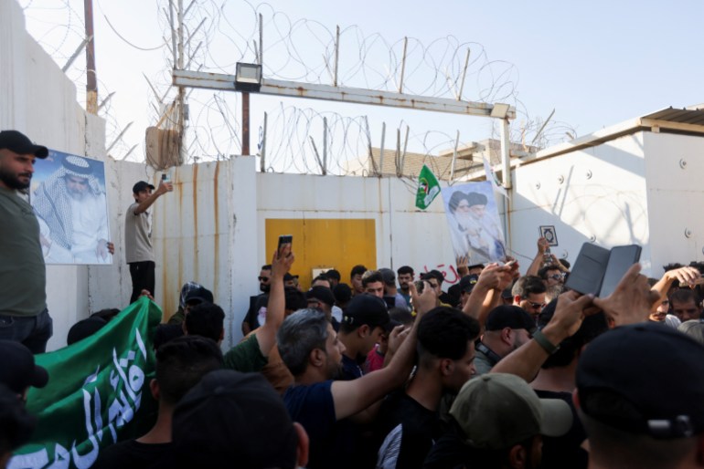Protesters gather at the entrance to the Swedish embassy in Baghdad a day after a man tore up and burned a copy of the Quran outside a mosque in the Swedish capital Stockholm, Iraq, June 29, 2023. 